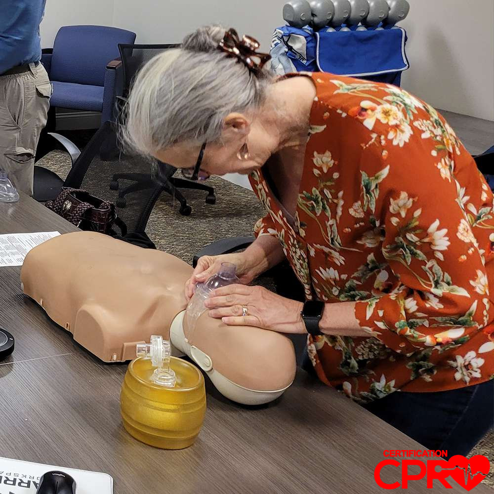 CPR training session with adult mannequin in Chicago.